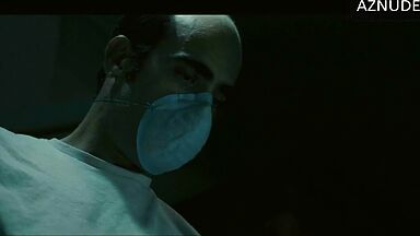 In underwear with the duvet on her