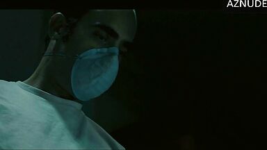 In underwear with the duvet on her