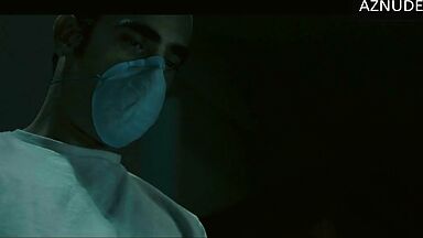 In underwear with the duvet on her