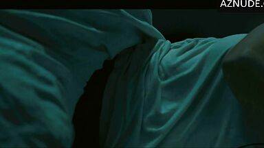 In underwear with the duvet on her