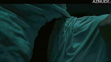 In underwear with the duvet on her