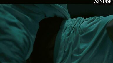 In underwear with the duvet on her