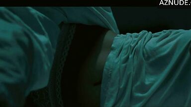 In underwear with the duvet on her