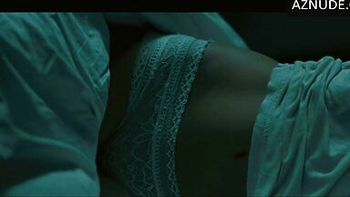 In underwear with the duvet on her