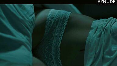 In underwear with the duvet on her