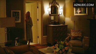 Margot Robbie undoing her sexy hair in front of the mirror