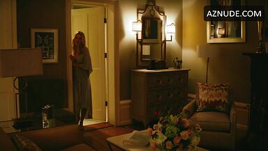 Margot Robbie undoing her sexy hair in front of the mirror