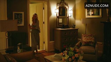 Margot Robbie undoing her sexy hair in front of the mirror