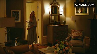 Margot Robbie undoing her sexy hair in front of the mirror