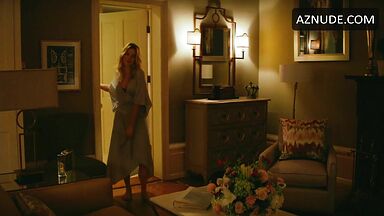 Margot Robbie undoing her sexy hair in front of the mirror