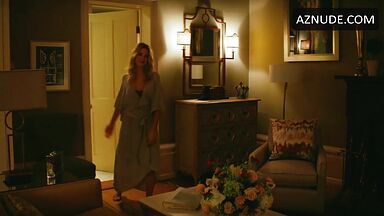 Margot Robbie undoing her sexy hair in front of the mirror