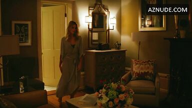 Margot Robbie undoing her sexy hair in front of the mirror