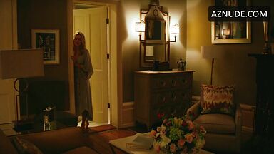 Margot Robbie undoing her sexy hair in front of the mirror