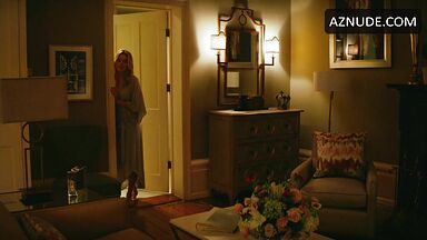 Margot Robbie undoing her sexy hair in front of the mirror