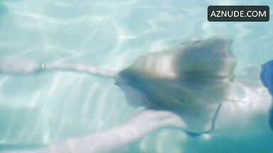 She in a swimsuit in the pool