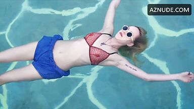 Dakota is floating in the pool