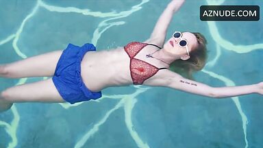 Dakota is floating in the pool