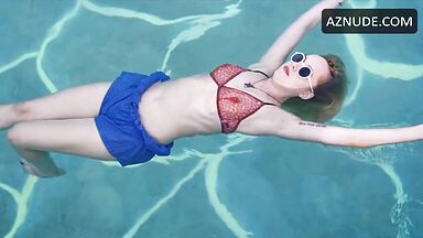 Dakota is floating in the pool