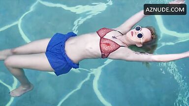 Dakota is floating in the pool
