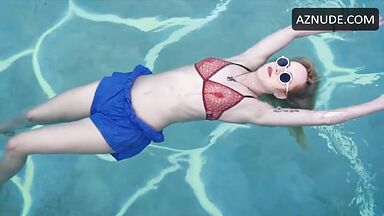 Dakota is floating in the pool