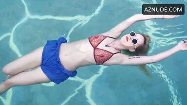 Dakota is floating in the pool