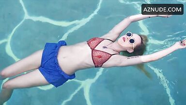Dakota is floating in the pool