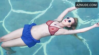 Dakota is floating in the pool