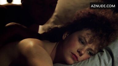 Sex in bed with a girl with curly hair