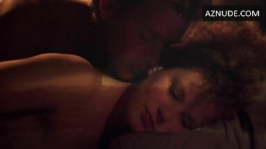 Sex in bed with a girl with curly hair
