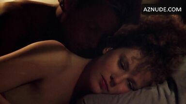 Sex in bed with a girl with curly hair