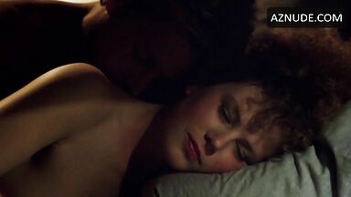 Sex in bed with a girl with curly hair