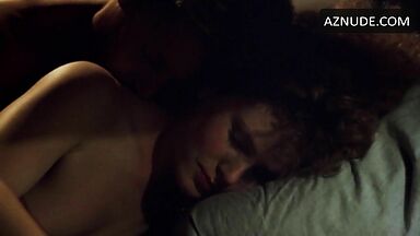 Sex in bed with a girl with curly hair