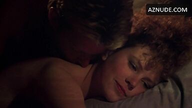 Sex in bed with a girl with curly hair