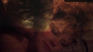 Sex in bed with a girl with curly hair