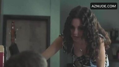 We see her cleavage