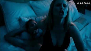 Sex in bed with her hand in his mouth