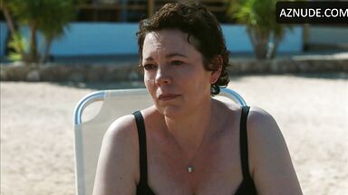 Wet in a swimsuit on a sun lounger