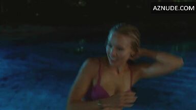 She comes out of the pool in a swimsuit