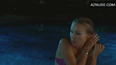 She comes out of the pool in a swimsuit