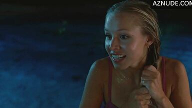 She comes out of the pool in a swimsuit