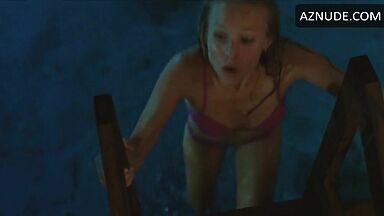 She comes out of the pool in a swimsuit