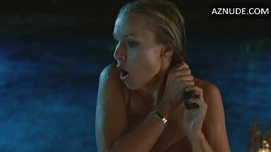 She comes out of the pool in a swimsuit