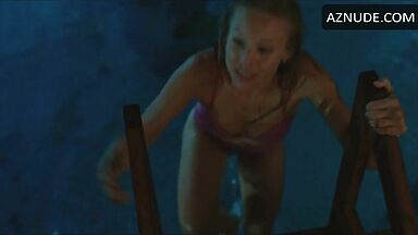 She comes out of the pool in a swimsuit