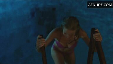 She comes out of the pool in a swimsuit