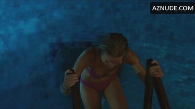 She comes out of the pool in a swimsuit
