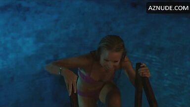 She comes out of the pool in a swimsuit