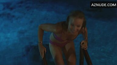 She comes out of the pool in a swimsuit
