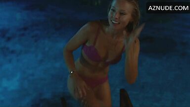 She comes out of the pool in a swimsuit