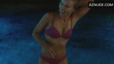 She comes out of the pool in a swimsuit