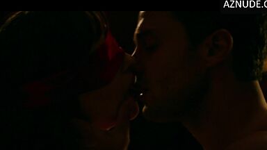 Blindfolded and handcuffed she has no escape